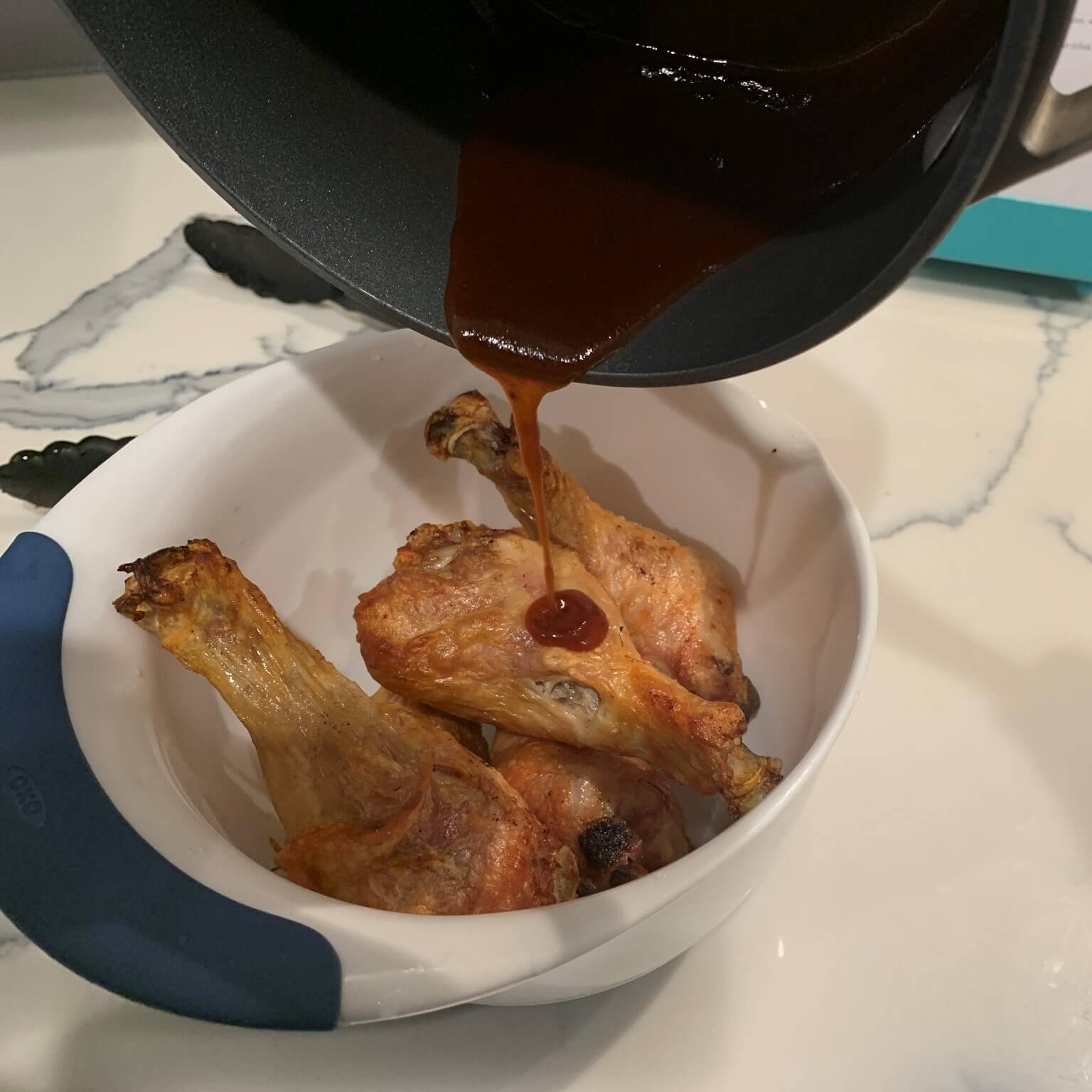 honey bbq chicken wings pour sauce on wings and toss